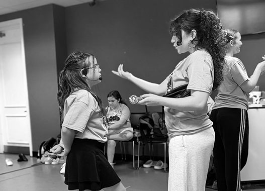 Ms. Hannah in a teaching moment with a student dancer